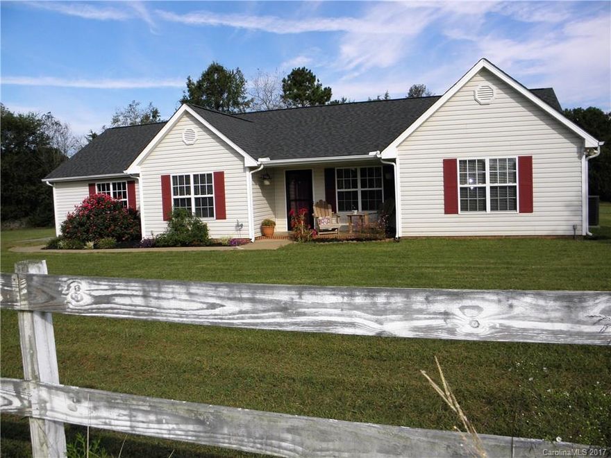Country living at its BEST! Located minutes away from historic downtown Waxhaw, convenient to shopping and restaurants, this charming ranch style split floor plan, accommodates every buyer's dream home! With 3 bedrooms and 2 full bathrooms, this home has plenty of space and a lovely open floor plan!  Home features oversize 2 car garage, tons of closet space in bedrooms,skylights for extra light,large master suite, private lot far from road, and overlooks a gorgeous pasture with pristine views!