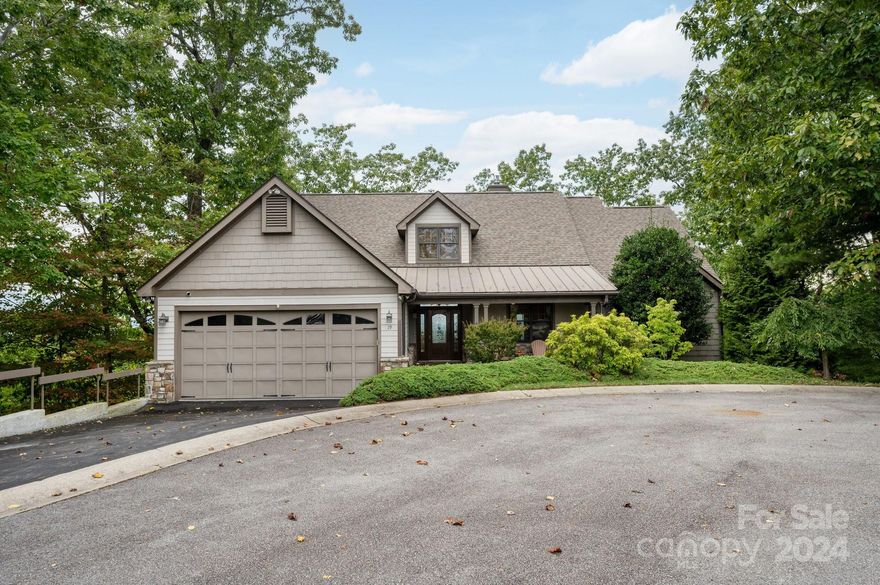 Look no further for an incredible mountain home with stunning year-round views, convenience to downtown Hendersonville, primary-level living, and an amazing kitchen. Downtown Hendersonville offers numerous groceries, local eateries, and a charming Main Street. Located 30 miles from downtown Asheville, this cul-de-sac location offers “privacy with community” in the Dunroy on Rutledge neighborhood. Its modern open floor plan includes an incredibly spacious kitchen, a fantastic screened-in deck with an oversized, automatic sliding door, and a natural gas fireplace ready for the fall season. Primary suite includes a private office, walk-in closet, and a very spacious ensuite bathroom. Home provides plenty of storage in the basement, including a large hobby room and a workshop space with utility sink and space for tools. Come see this stunning home in person. View the brochure, video, floor plan, and features for more info. No known damage from Hurricane Helene. Water and power are on!