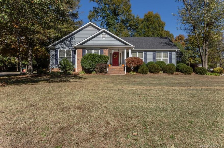 Inviting front porch. Hardwood floors in foyer extend through great room with wood burning fireplace and ceiling fan. Formal room with moulding & carpet.  Roof 4 yrs old. HVAC 3 yrs old. New black appliances. Kitchen features tile and glass backsplash, granite counters, and raised panel cabinets. Master suite with ceiling fan, master bath with dual sink vanity, jet tub, tile floor, stand up shower. Huge deck overlooks private, fenced back yard with spacious out building for added storage.