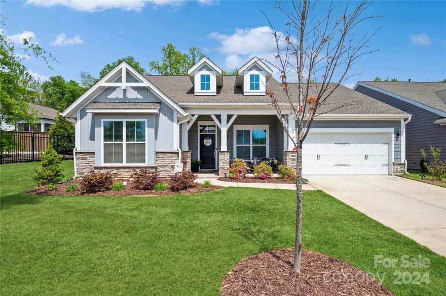 Move-in ready elegant + charming David Weekley open-concept ranch in desirable Ansley Park. The light & bright chef's kitchen is nicely equipped with upgraded KitchenAid SS appliances, white cabinets, tiled back splash, large island and abundant granite counter space. LVP flooring throughout entire home. Large windows in the great room bring in natural light and a great view of back yard. Primary bedroom suite boasts tray ceiling, dual sinks in bath and custom closet with built-ins for enhanced storage & organization. Appealing split bedroom design and a generous flex-space which can be used an office, den or exercise room. Inviting outdoor living space features relaxing screened porch overlooking extended patio with pavers and fenced yard. Cozy front porch adds tons of curb appeal and place to relax. Community features an amenity center which hosts a clubhouse, pool, playground and walking trails. Conveniently located & close to shopping, dining, attractions, Hwy 521 and Ballantyne.