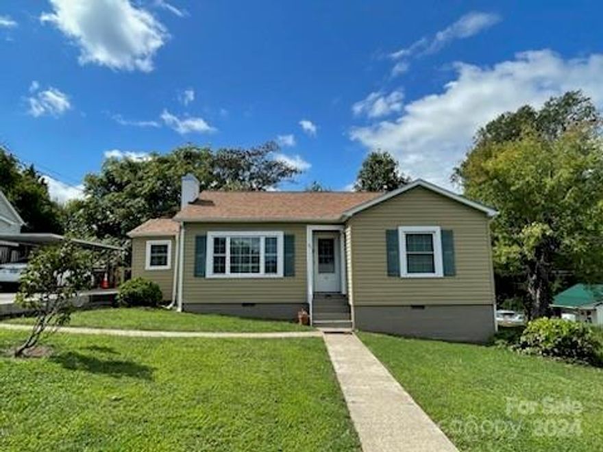 This cozy and charming home is a must see!  Located conveniently in town, the 2 bedroom/1 bath house is the perfect starter home.  The house sits on approximately 0.15 acres and features an eat-in kitchen with ample cabinet space, a large family room, utility room that includes a washer/dryer with the sell of the property, a sun room, and a rear deck to enjoy the scenery outside.  Come see this beautiful, move-in ready home!