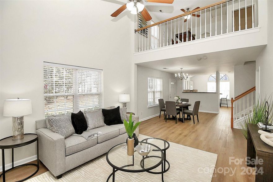 Check this fantastic move-in ready, end-unit townhouse, with tons of natural light and a nice deck backing to the woods!
This home is completely move-in ready with fresh paint throughout (including the kitchen cabinets, which look amazing), and recently installed LVP on the main floor. The super high ceilings both in the living room and primary bedroom make the space feel grand. The loft has a closet and could easily become a third bedroom. 
There is a community pool, a playground and a covered picnic area. 
And the icing on the cake is the location: just between Ballantyne and Fort Mill, close to everything you want - shopping, entertainment, and food. And let's not forget the Indian Land schools! It's a win-win-win! 
(Oh! And there is a Cosco being built across the street. Literally across the street.)