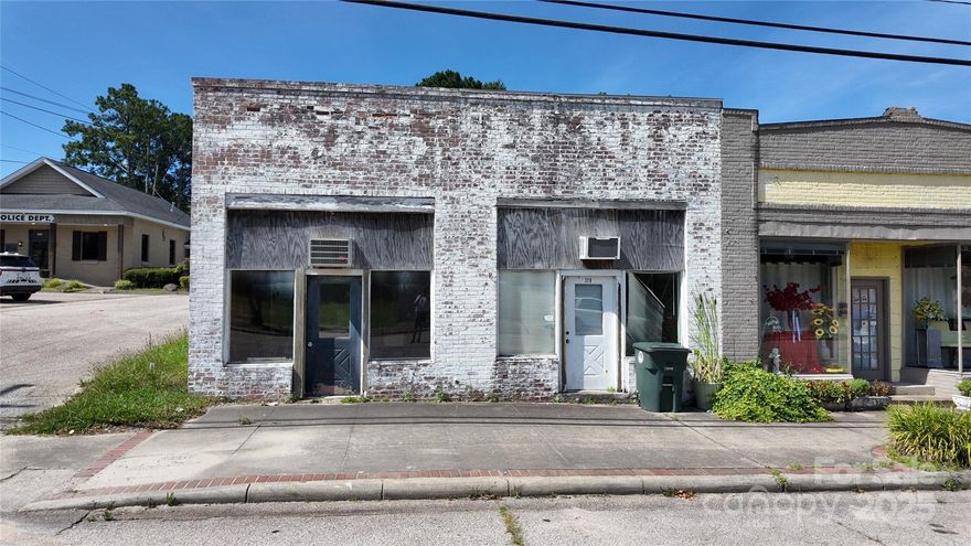 Located in downtown Great Falls, this commercial offering includes two separate buildings on one parcel. 320 Dearborn features approximately 924 sq ft with a reception area, office, additional room, and a half bath. 322 Dearborn offers an additional 525 sq ft and includes a reception area, office, storage space, and a half bath. With flexible layouts and a central location, this property presents a unique opportunity for a variety of business or investment uses.