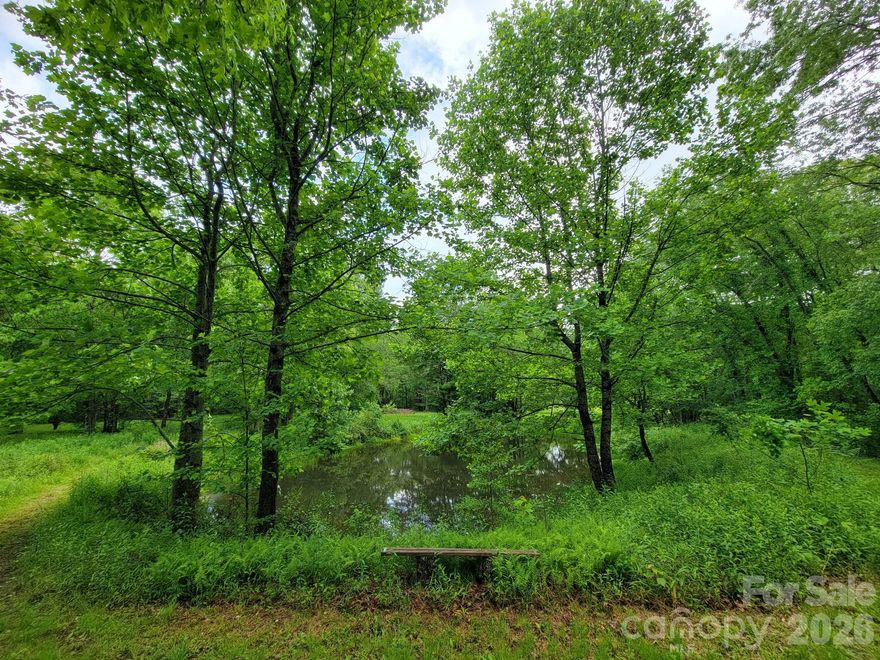 Tucked away in the peaceful mountain community of Sweetwater Ridge, Lot 1 offers a rare opportunity to create your own private retreat surrounded by nature. This 2.112-acre property features a beautiful full pond plus a partial shared pond, creating a serene, Walden Pond-inspired setting that feels worlds away from the everyday hustle.

Adding to the privacy and natural beauty, the property behind the lot is designated POA Open Space, helping preserve the peaceful wooded backdrop and enhancing the sense of seclusion.

Nature lovers will appreciate the opportunity to enjoy mountain wildlife right from their own property, including sightings of graceful Blue Herons around the ponds, along with other native wildlife that make this setting feel truly special.

A septic permit is already on file with the county, and the roadbed is in place for easy access to the homesite, helping you get one step closer to building your dream mountain getaway, full-time residence, or vacation escape.

Enjoy the sights and sounds of nature right outside your door while still being conveniently located near some of Western North Carolina’s most beloved destinations, including Pisgah Astronomical Research Institute, Pisgah National Forest, and the iconic Blue Ridge Parkway. Whether your passion is hiking, fishing, stargazing, waterfalls, or simply relaxing in the mountains, this property places you close to it all.

If you have been searching for a quiet mountain setting with water features, privacy, and easy access to outdoor adventure, Lot 1 Sweetwater Ridge is ready to inspire your vision.