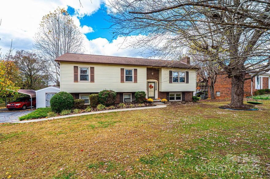 A Home Filled with Space, Warmth & New Memories Waiting to Happen! Step inside and feel right at home in this inviting split-foyer full of charm and comfort. The main level welcomes you with a bright, open living room, dining area, and a kitchen with bar seating—perfect for gathering with family and friends, sharing meals, and making everyday moments special. Down the hall are 3 cozy bedrooms and two full baths, offering a peaceful retreat at the end of the day. The finished lower level provides even more room for memories—whether it’s movie nights by the gas log fireplace, a home office, or a welcoming guest space. Outside, you’ll find places that invite laughter and connection—a spacious covered deck and a lower deck below overlooking a beautiful backyard. There’s room to play, grow, and relax with two storage sheds (one with a loft), plus an 18' x 20' detached carport, a 12.2' x 12.2' detached building, a 12.2' x 12.2' lofted building with a 6' x 12' rear shed, and a 40' x 41' blacktop area perfect for basketball games or extra parking. A one-car garage and laundry area offer space for projects and storage—everything you need to make life comfortable and easy. From cozy nights to sunny afternoons spent outdoors, this home is more than just a place to live—it’s where new stories begin.