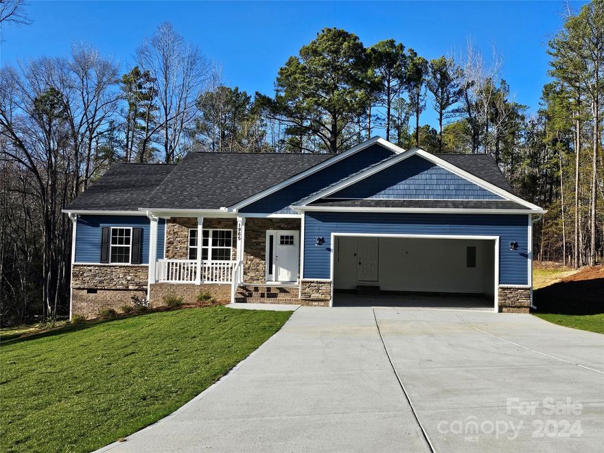 New construction home on almost 3 acres. Home has 3 bedrooms 2 full baths.  9ft ceilings, rear screen porch off the dining area.  Large 24 x 24 garage.