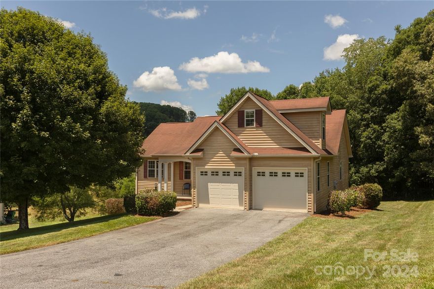 Make your dreams come true and live in a lovely single-family home in the highly desired Mills River area!  Sip your favorite beverage on the back deck while enjoying year-round mountain views. 

Three bedrooms & two full baths all on the main floor. The main bedroom has a private bathroom & a walk-in closet. The open-concept living room opens up to the kitchen & dining area.  The kitchen is equipped with an electric stovetop/oven range, microwave, dishwasher, and refrigerator.

The dining room is directly off the kitchen.  The laundry room is on the main level off the front hallway alongside the attached two-stall garage. The upstairs bonus room is ideal for an office, playroom, den, or craft room. 

Let your imagination run wild finishing out walkout 1,500+ square foot basement.  It is already roughed in for a laundry sink and another full bathroom.  It has unlimited possibilities for a den, apartment, playroom, or additional bedrooms, with plenty of storage to spare.