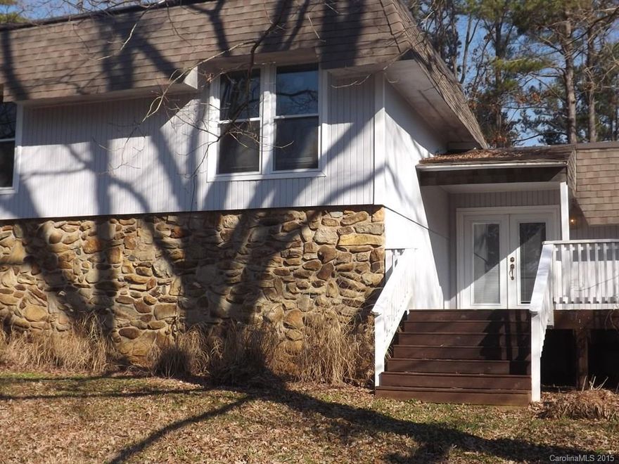 Fixer upper w/great potential! Spacious split level 3BRs & 3 full BAs home in Tega Cay. Open floor plan 2 level living room w/French doors. Home features a den/office, formal dining, lg KIT, 2BRs & master BR on the upper level of the home. Outside features are lg covered patio & deck on corner lot. Rear lot of property is not included in this sale of the home, however it is for sale. Brown storage building does encroach onto rear adjoining lot. Sellers will remove. Hot tub is sold as is.