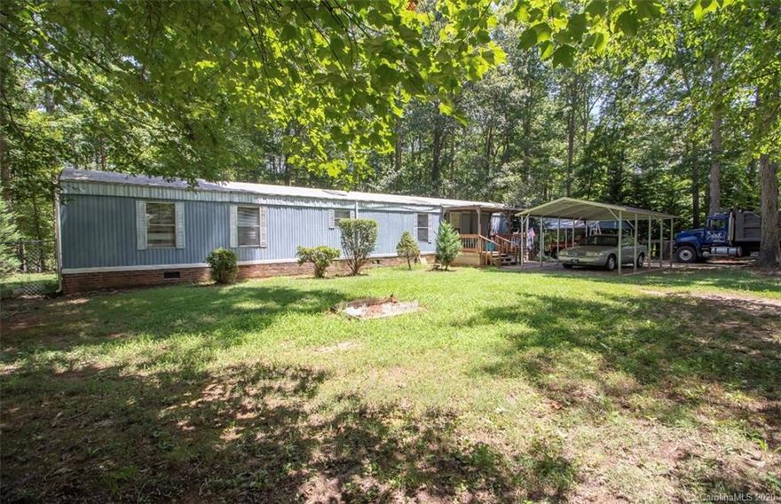 Country living in the highly sought after Clover school district! Tons of new features, including new flooring (2017), new HVAC (2018), new septic lines (and tank pumped 2017), and new appliances! Detached workshop/man cave with wood stove is an awesome addition to the home. The yard is fenced and has a separate dog lot with a new pen, and a chicken coop! This home has been lovingly maintained by the original owner. There are two carports and sheds for storage. All of this on 1.46 acres at the end of a cul-de-sac! Only 4 miles to the proposed Kings Mountain Casino!  Welcome home!