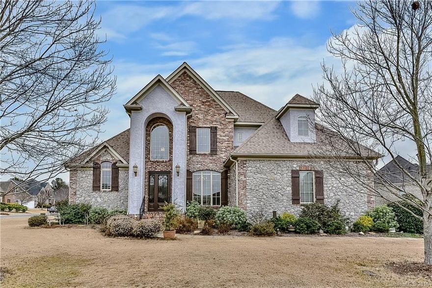 Hard to find Custom Brick home w/Master & Guest Suite on Main Level. Dream kitchen boasts granite counter tops, large center island & designer cabinets. Open floor plan overlooks Breakfast, Kitchen & Great Room w/ fireplace.  Walk out onto your beautifully designed patio & relax. Stunning designer touches including hardwood stairs leading up to 2 over sized bedrooms & spacious bonus room. Close to I-77 & Ballantyne, Award Winning Fort Mill Schools & low SC taxes.  Hurry won't last!