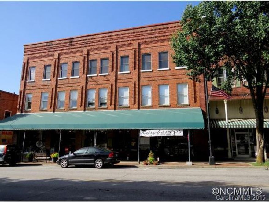 Live in a turn of the century loft in downtown Brevard, enjoy shopping and restaurants at your fingertips, have a mountain view and enjoy proximity to numerous state/national forests! This is truly a one of a kind listing and so desirable if you love urban living. This loft is move-in ready with new windows, modern kitchen, newer heating/air systems and economical upkeep costs. Vintage wood floors, chandeliers, and ceilings-and parking provided!