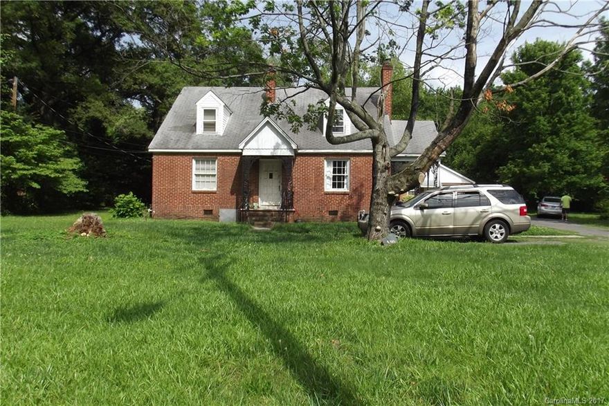 Investors! Spacious brick Home with 3 rental units.  Lower level has 2 bed 1 bath, dining room, family room. kitchen, porch and unheated enclosed porch with laundry. Upper 1 bedroom, bath, Family room and Kitchen. Garage 3rd living quarters 1 bed, bath, kitchen and living room. New 30 yr. architectural roof to be installed. Storage shed. Gorgeous level ½ ac lot. Current rental income $1700