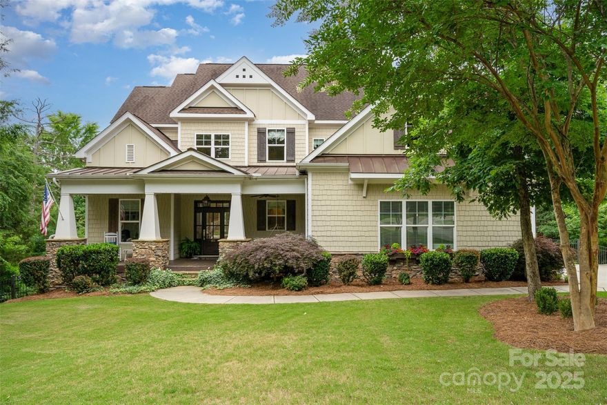 Stunning 3-level custom home in sought-after Heron Cove on Lake Wylie! The gourmet kitchen boasts quartz countertops, custom cabinetry, updated appliances including gas cooktop & large island—perfect for entertaining. Gleaming hardwoods flow throughout the home - no carpet! The main-floor primary suite is a peaceful retreat w/wooded views, oversized walk-in closet & spa-like bath featuring soaker tub, custom tile shower & dual vanity. Upstairs includes a guest suite w/private bath, two bedrooms w/a Jack & Jill bath & two flex spaces ideal for a media room, gym or playroom. Finished walkout basement offers a rec room, kitchenette/bar, two guest suites & 700 sq ft of storage. Step outside to a covered patio w/custom fireplace—ideal for chilly nights. The fenced backyard is wooded & private w/garden & space for a pool. Amenities include a pool, kayak launch, playground & boat/RV storage. Award-winning Clover Schools, low SC taxes & easy access to Charlotte, airport & Lake Wylie launches.