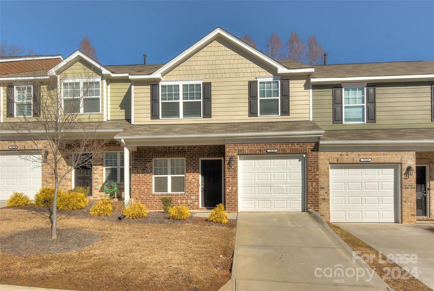 Discover the perfect blend of comfort and style in this charming 2-story, transitional townhome in the sought-after Townes at University East. Step into seamless living with an open floor plan where the main level unfolds to reveal a welcoming living room, a well-equipped kitchen with appliances, a dining area, and a convenient powder room. As you ascend to the upper level, you'll find two inviting bedrooms, each with its own full bathroom for added privacy. The upper level also features a laundry area and a versatile loft space, offering flexibility for your lifestyle needs. Enjoy the convenience of a main-level garage with space for one car, complemented by an attached driveway made of durable concrete. Relax on the covered front porch or retreat to the patio, creating the perfect spaces for outdoor enjoyment. This thoughtfully designed townhome is move-in ready.