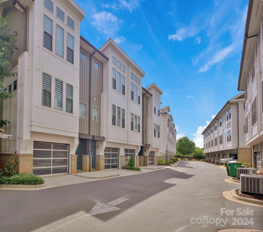 Hidden gem in the heart of Southend.  Walkability! Shops, restaurants, nightlife and light rail within minutes! Great floor plan offers oversized attached garage w/additional storage.  Kitchen w/large quartz island & countertop, stainless appliances including refrigerator and pantry. Access to rear enclosed deck. Half bath on this level and open to great room w/ceiling fan.  Upper level offers spacious primary suite w/walk in closet, laundry, additional closet, built in cabinetry & ceiling fan.  Bath offers dual sinks, quartz countertop, oversized glass/tile shower and linen closet.  Custom window treatments and beautiful wood flooring throughout.  New HVAC 8/23.  Agent is related to owner.  Move in ready!