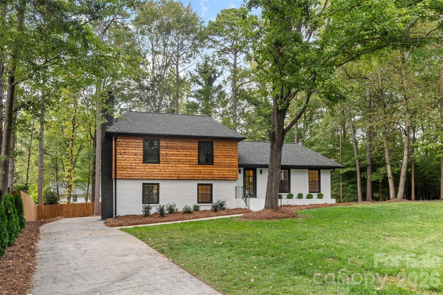 Welcome to 509 Selkirk Place, a fully remodeled home tucked away on a quiet cul-de-sac in Heritage Woods. This split-level beauty combines modern style with flexible living. The upper level offers three bedrooms and two full baths, while the lower level includes a fourth bedroom, full bath, and a cozy family room with fireplace—perfect for guests or movie nights. On the main level, enjoy a sun-filled living room, separate dining area, and a stunning new kitchen with a large island. Step outside to a spacious deck overlooking a level, fenced backyard with mature trees—ideal for relaxing or entertaining. Every detail has been updated: NEW roof, NEW windows, NEW hardwood floors, all NEW bathrooms, NEW doors, and NEW exquisite woodwork throughout. Flooded with natural light, this home sits on one of the best lots in the neighborhood with an extended driveway for ample parking. Just a 2-minute walk to the McAlpine Creek Greenway and minutes from shopping, dining, and commuter routes.