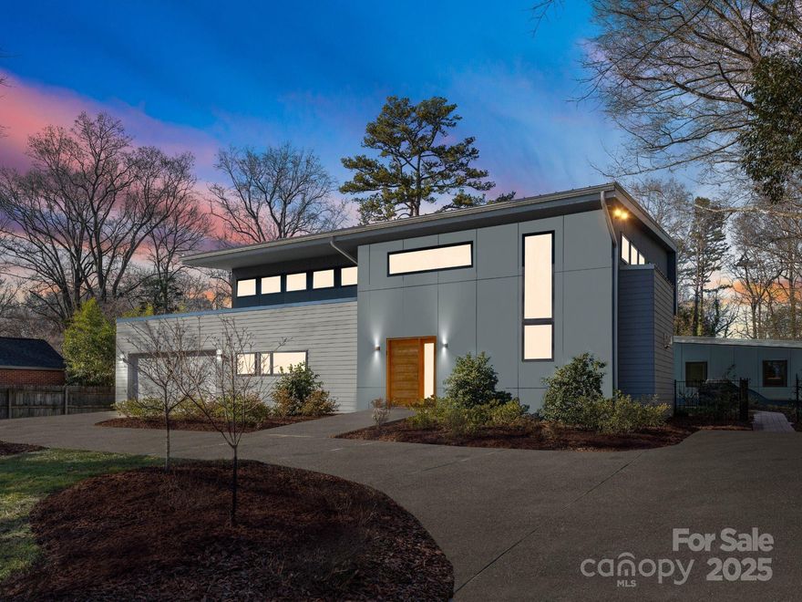 This amazing light filled modern home built in 2021 offers the concept of one level living in mind. The sleek exterior welcomes you into an impressive great room w/ 2 story ceiling, tiled surround gas fireplace & custom built-ins.  Extra large screened porch serves as another living space w/ sliding doors. The kitchen has a large center island with built-ins, high end appliances, lots of cabinetry and tons of natural light. There is a large laundry room, powder room and small office area on the main level. Amazing primary suite w/ a private screened porch. Primary bath has a large walk-in custom closet. The heated salt water pool is surrounded by the home. The upper level offers 2 additional bedrooms & a full bath. The casita has a full bath, kitchenette, and can serve as a guest room, bonus room or pool house. An abundance of yard space behind the pool offers incredible privacy. The home has solar panels/ 11.5 MWH system & a Level 2 charging outlet for PHEV or EV vehicles.