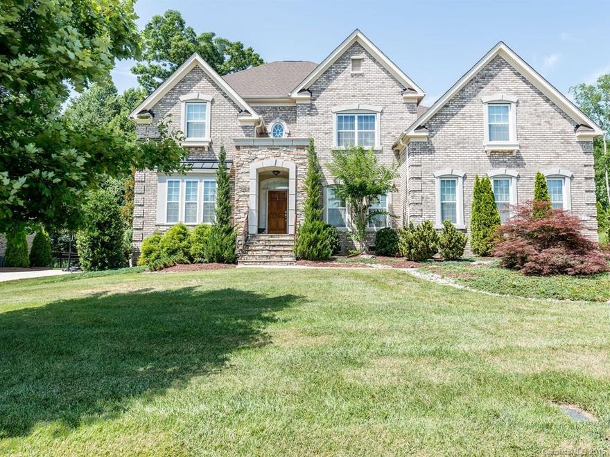 WOW! Exquisite Beauty with the MOST Fantastic Outdoor Living Space Complete with Paver Patio, Deck, Fireplace, Gas Grill with Counter Space PLUS shading Ambient Arbor! Stunning Features: curved staircases and walls, Juliet balcony, dark hardwoods, Gourmet Kitchen, Butler’s Pantry, Master Suite with romantic fireplace & sitting room, full brick & stone exterior. Lush ½ acre yard. Set in the highly sought after Weddington area!