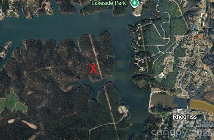 Nestled in Burke County’s gated Lakeside Reserve community on Lake Rhodhiss, 2218 Princeton Mtn (Lot 63) offers a .935-acre homesite, ideal for your future custom build in a resort-style lake neighborhood. Enjoy a relaxed, outdoor-focused lifestyle with paved roads and underground utilities, close to Hickory, Morganton, and I-40 for convenient regional access.

Lakeside Reserve residents have access to an amenity package that typically includes an outdoor pool, open-air clubhouse with fireplace, pickleball courts, lakeside park, sandy beach, kayak launch, walking trails, and secure boat/RV storage, all designed to maximize time on beautiful Lake Rhodhiss. Community standards are protected by recorded covenants and an Architectural Review Committee, with minimum heated square footage requirements (commonly 1,400 sq ft on interior/non-lakefront lots and 1,600 sq ft on lakefront lots), no time limit to build, and the ability to choose your own builder; mobile homes and RVs used as residences are generally not permitted in similar Lakeside Reserve lots. See attached CCRs for ARC guidelines, home size minimums, design standards, and any restrictions on short-term rentals, fencing, outbuildings, and animals.  

Nearby listings in Lakeside Reserve show county water availability, underground power and communications, and required septic systems, with Burke County zoning typically R-3 in this section of the lake area; confirm exact zoning, Shoreline Protection Overlay status, and any additional lake-area permits with Burke County Planning and Zoning. Annual HOA dues in Lakeside Reserve have recently been reported in the $975–$1,025 range for similar interior and lake-area lots, covering operation and maintenance of gated access, amenities, and common areas; current fees, transfer charges, and any special assessments should be confirmed with the association (Community Manager is Scott Bole with FirstService Residential).

Although this property is not deemed to be in a flood zone, flood risk, elevation, and detailed topography for this parcel can be evaluated through North Carolina’s Flood Risk Information System (flood.nc.gov) and Burke County GIS, which provide address-specific flood hazard data and mapping; buyers and their insurers should rely on those official resources for final flood-zone determinations and any insurance or building-code requirements. All information is based on public records and representative listings within Lakeside Reserve and Burke County and is subject to verification by buyer, buyer’s agent, Burke County, and the HOA; restrictions, fees, and zoning are subject to change without notice.