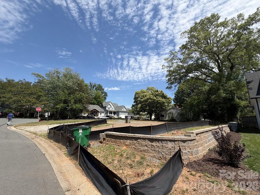 Exceptional opportunity to build your dream home on a prime corner lot in the desirable Sedgefield neighborhood. The site is build-ready, featuring approximately $75,000 in completed grading, including a professionally installed retaining wall—significantly reducing upfront construction costs. A rare offering with major site preparation already completed in an established area.