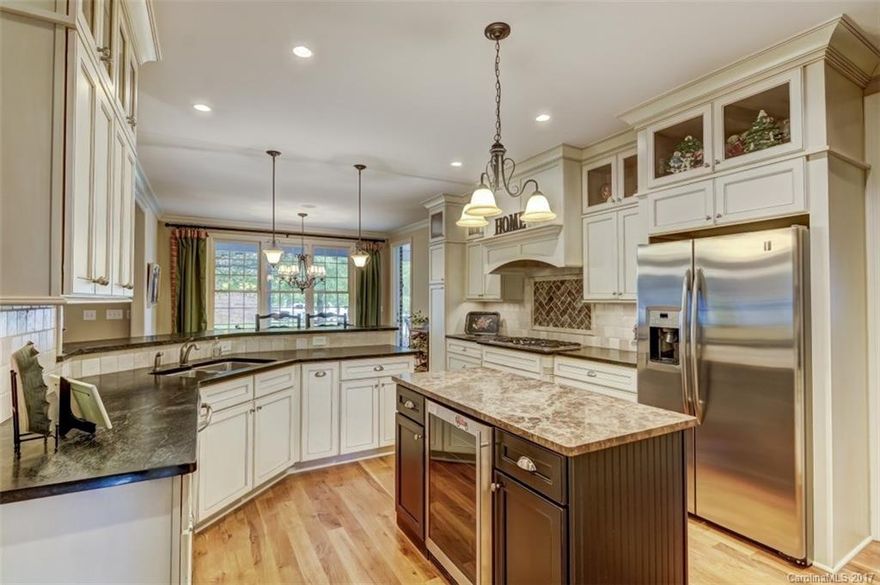 Beautiful custom home in desirable Cornelius with easy access to Charlotte.  Quiet lake-community living.  Spacious, open floorplan throughout with master and guest down.  Bonus room up, and every bedroom has a bathroom connected.  Pictures speak for themselves...you want to live here and don't want to miss it!