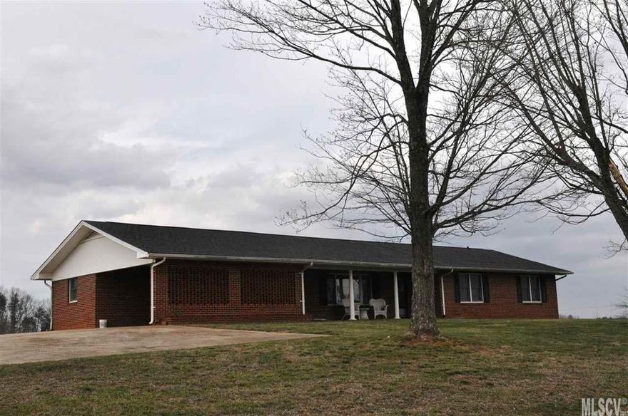 A beautiful, well maintained brick ranch nestled on 12.35 acres with scenic mountain views from the front yard to the back. This 3 Bedroom 2.5 Bath is a must see to appreciate the beauty of this home. It has been updated from the Main Level to the Basement and has great entertaining features. Step inside the Living Room and pull up a chair to rest after a long day. Enjoy cooking in the large open Kitchen with plenty of countertop space and cabinet storage. The Kitchen displays tile flooring and flows smoothly into the Dining Room. Master Bedroom with walk-in closets and wood flooring. Master Bath with tile flooring, double vanity, and cabinet space for storage. The downstairs Den is a great place to relax or entertain guests and enjoy a cozy warm fire. Updates include: flooring, drop ceiling, and painted walls. The unfinished Basement area includes storage for lawn equipment and a bathroom to clean up after being outside.