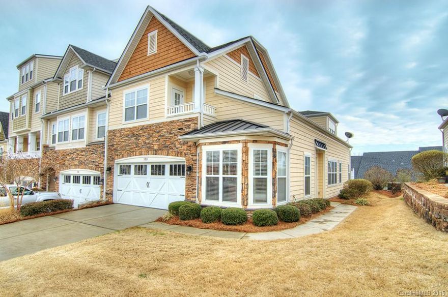 Simply gorgeous and elegant end unit townhouse with lake views. Beautifully maintained, barely lived in, shows like a dream. Professionally decorated with custom touches throughout.  Plenty of windows, soaring ceilings, spacious master on main, private balcony decks off second level bedrooms, open loft for added entertainment possibilities.  Enjoy all that living the good life has to offer.   Located in the sought after Tega Cay Peninsula, walk to lake, pool, trails, parks. Perfection.