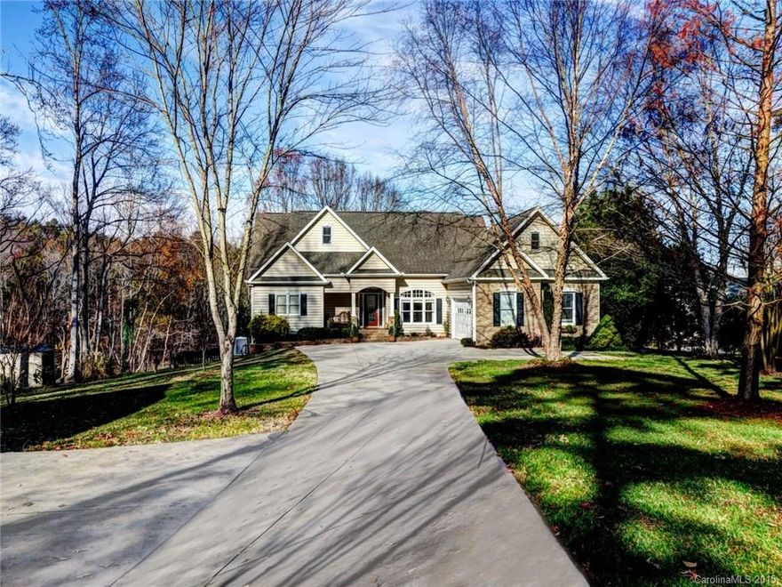 Beautiful waterfront home located on 1.20 acres! Waterfront cove lot w/ floating dock. Enjoy the koi pond, mature landscaping, & lake views on the large patio w/ pergola, screened in porch, or the upper deck! Finished walk out basement w/ rec room, bed & full bath, & additional room. Large bonus over garage. Nice open floor plan for easy indoor entertaining! 2 Story Great room features cathedral ceilings & a gas log fp. Gleaming hardwoods throughout main. Garage space for 4 cars! A must see!