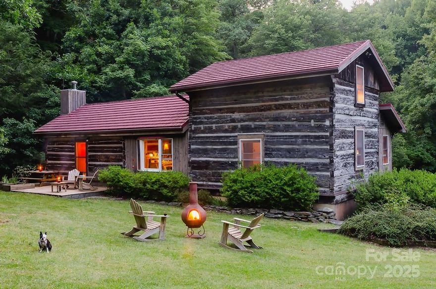 Step away and into a magical and simpler time. Amazing historic hand-hewn log cabin tucked away on 103 acres adjoining National Forest. Many artistic and craftsman details blended with all the modern conveniences; New HVAC system and appliances, new metal roof, central vacuum, whole house generator and fast fiber internet. Great room with fireplace/insert. Cathedral beamed ceilings.  Chef's country kitchen. Huge family room with beautiful views of the property. Spacious master suite w/ bath on main level. Whirlpool. Beautiful guest suite w/ private bath. Shop. Garage. Decks, fire-pit, sitting areas providing wonderful outdoor living spaces.  Idyllic setting overlooking creek, meadows and large picturesque stocked pond. Lots of scenic woodland and creek-side trails throughout property for hiking and ATVs. Level pastures. Peaceful living in a pristine natural world!
