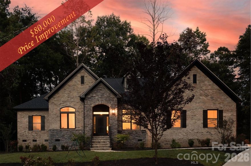 Lake Wylie Oasis! This luxurious ranch is a recent built beauty by one of Carolinas top luxury builders. Home is located in the highly sought-after lake front community neighborhood, The Landing. This pristine 4-bedrooms, 2.5-baths, 2-offices, full-brick and stone residence blends architectural charm with modern functionality that boasts a host of upgrades making it truly exceptional. Inside, you'll find an open-concept layout drenched in natural light, vaulted ceilings and an inviting flow between the family, dining and kitchen areas perfect for entertaining family and friends. The upgraded gourmet kitchen is a chef's dream, complete with premium cabinetry, quartz countertops and quartz backsplash, stainless-steel appliances, large custom walk-in-pantry, upgraded 5-burner gas cooktop designed for cooking the perfect meal in style. The huge primary suite offers a private retreat with a spa inspired primary bath that includes a spacious and upgraded full tile shower, dual vanities and separate walk-in closet making it your own personal sanctuary. You will have more than enough space to comfortably host family and guests with three additional bedrooms on the opposite side of the home. You have 2 offices, a front office and a separate convenient pocket office located off the primary bedroom offering you flexible dedicated space for working from home, studying, your favorite pass time or as a flex room. This home also offers a mud room and spacious laundry room with custom built ins. This rare ranch home provides Indoor-outdoor living at it best. Outdoor living is enhanced by a large private covered porch with high ceilings and large ceiling fan. Oversized 2-car side-load garage, upgraded exterior finishes and expert manicured lawn gives this home beautiful curb-appeal for all your friends to admire. Quality craftsmanship is evident throughout, from custom millwork to energy-efficient features that add both beauty and value. 2 grand picturesque windows (family room & primary) provide beautiful nature views for relaxing from every angle. This Lake Wylie luxurious style ranch home offers upgrades carefully chosen to elevate your lifestyle. Coupled with the spacious, private, cul-de-sac lot in this quite tree-lined streets, golf-cart friendly established waterside community, decision making becomes a breeze. Community is across the street from Publix, Walmart and dining all while enjoying top rated schools in Clover Schools! This Lake Wylie Recently Built Ranch Home is Immaculate! While this home does not have a deeded boat slip, boat slips are often available for lease or purchase.