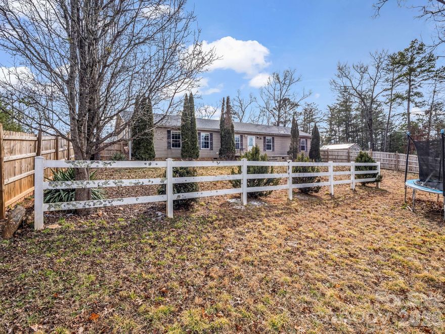 Tucked away on almost 3 acres of peaceful, wooded land, this well-maintained modular home offers privacy, quiet, and the relaxed mountain lifestyle Lake Lure is known for. Surrounded by nature, the property provides a serene setting with plenty of room to enjoy outdoor living, gardening, or future expansion. Inside, the home features a functional layout filled with natural light and comfortable living spaces, perfect as a full-time residence, weekend getaway, or investment opportunity. Located just minutes from Lake Lure, Chimney Rock, hiking trails, and local dining, this property combines seclusion with convenient access to area amenities. A rare opportunity to own acreage in a sought-after mountain destination.