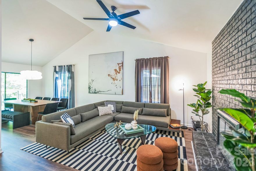 THE MOUNTAIN DREAM HOME YOU HAVE BEEN SEARCHING FOR! $250K+ REMODEL. This home features top-to-bottom renovations, high-end upgrades, custom furnishings, and professional interior design— all complemented by a brand new wraparound deck, perfect for relaxing or entertaining! This spacious 4-bedroom, 4-bathroom home is located in a peaceful cul-de-sac in Asheville and sits on gorgeous a 1/2 acre lot. This home boasts charm in every room! The primary bedroom with an ensuite bath, along with a secondary bedroom and full bath, are located on the main floor for convenient one-level living. Upstairs, you'll find a versatile bonus room that can be used as an additional bedroom or home office, complete with its own bath. Downstairs, the lower level boasts a cozy entertainment, another bedroom with a full bath, providing ideal space for guests or extended family. Conveniently located just minutes from downtown Asheville! **Furniture can be negotiated**