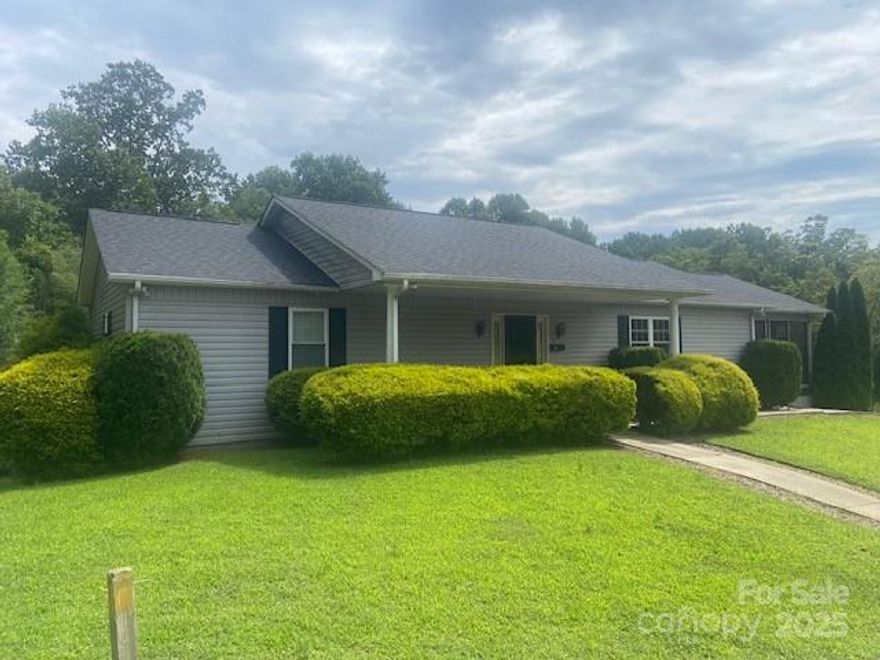 Must see this over 2600 sf w/3BR's 2Bath on main floor and another 2BR and 1 bath in partially finished lower level. Property consist of 3 lots totaling nearly 1 full acre conveniently located in downtown Lenoir. Easy access to schools, shopping etc. Large open living, dining and kitchen area plus over sized 18x24 screened in porch for enjoying your morning coffee. This home will not last at this price. Home also includes a 1year homebuyer warranty. $229,500