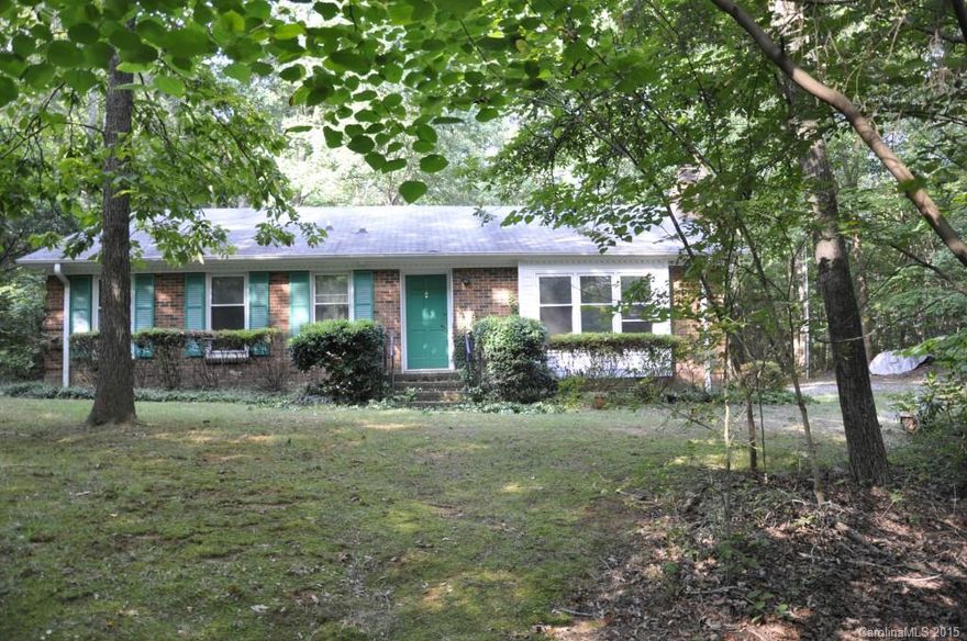Great 1459 sf starter home on wooded 1.38 acre lot with detached 2 car garage. Garage has plenty of space for a workshop and is wired for electricity. Located just 2 miles from I-485 this 3 bedroom 2 full bath property is ready to make your own. Both full baths have been recently renovated with new flooring, granite vanity tops, sinks and plumbing fixtures. The master bath has a new fully tiled shower. HVAC system was replaced in September 2013.  Seller is related to agent.