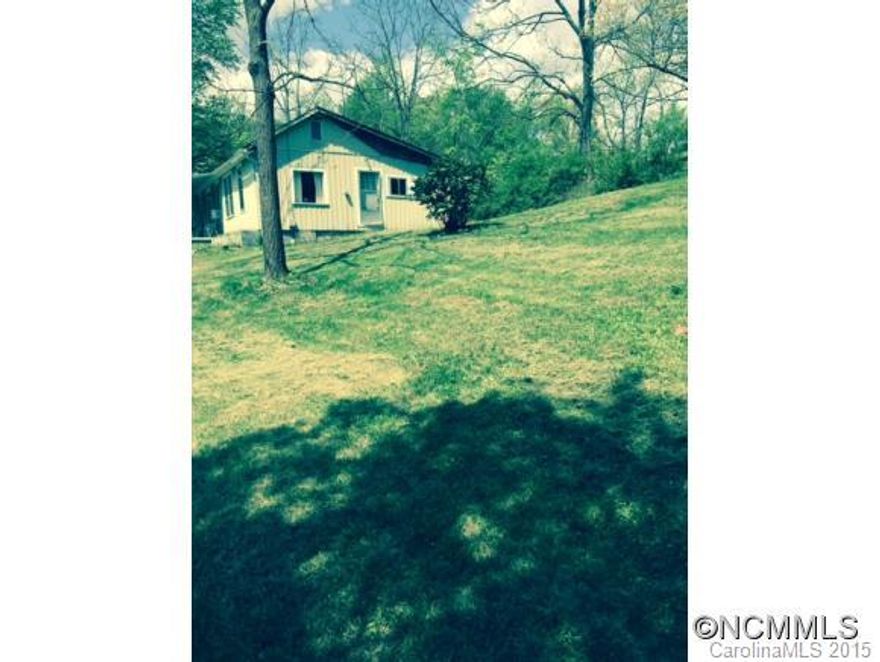 Home has little value. Property is being sold for the value of the land and the location. Very nice 1.2 acre tract with a garden spot. Possible 4 building sites. Private sewer, city water. Buyer to verify all information. Enter home at your own risk. Property transferred by special warranty deed in accordance with NC General Statutes.