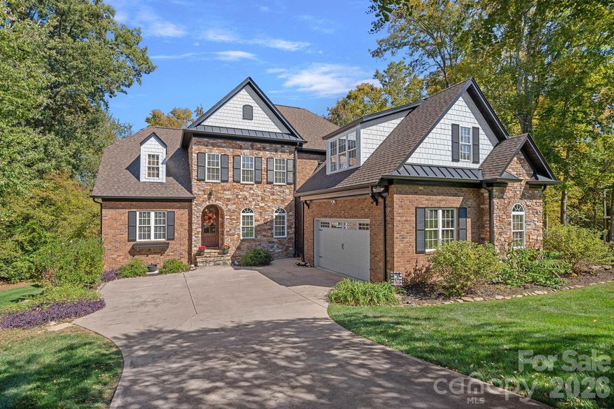 Welcome to 7809 Oak Haven Lane, a beautifully appointed home in the sought-after Treetops subdivision of Cowans Ford, North Carolina. Perfectly positioned along the 7th hole of the prestigious Cowans Ford Golf Course, this 5-bedroom, 4-bathroom residence offers over 4,100 square feet of thoughtfully designed living space — plus nearly 1,300 square feet of unfinished storage or future expansion — blending timeless craftsmanship with modern upgrades and exceptional livability.

From the moment you step inside, you'll appreciate the warmth and sophistication that define this home. Gleaming hardwood floors flow throughout the main level, leading you into a spacious, light-filled living area designed for gathering and entertaining. The heart of the home is a well-appointed kitchen with abundant cabinetry, premium finishes, and seamless flow into the dining and living spaces — ideal for hosting family and friends.

The main-level primary suite is a private retreat, offering comfort and convenience with a luxurious ensuite bath and generous closet space. Upstairs, a versatile bonus room provides the perfect space for a playroom, office, or media lounge, while a dedicated craft room caters to hobbies, creative projects, or work-from-home needs. A home theater room delivers a cinematic experience right at home — perfect for movie nights and entertaining guests.

The expansive basement is another highlight, with nearly 1,300 square feet of unfinished space ready to be customized into a home gym, wine cellar, additional living quarters, or abundant storage.

Outdoor living is just as inviting, with a secluded patio and an upper-level deck that offer peaceful spaces to unwind and enjoy seasonal views of the golf course. Whether you’re hosting summer barbecues, fall evenings by a fire pit, or quiet morning coffee surrounded by nature, this home’s outdoor spaces make every day feel like a getaway.

Recent upgrades, including a new roof (2023), fresh interior paint (2022), and smart thermostats, provide peace of mind and modern convenience. A custom drop zone off the garage adds everyday functionality, while proximity to the Cowans Ford Golf Club — with optional membership for golf, dining, and social events — offers an unparalleled lifestyle opportunity.

Located just 25 minutes from Charlotte Douglas International Airport and within easy reach of Lake Norman, shopping, and dining, 7809 Oak Haven Lane combines the best of privacy, space, and convenience. With its spacious layout, entertainment-ready design, and premier golf course setting, this home is an ideal choice for those who love to host, gather, and live beautifully.