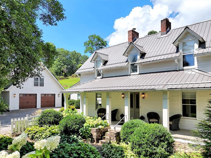 Step into a perfect blend of history and modern elegance with this completely renovated & mostly furnished 1890 farmhouse with thoughtfully curated details.  Situated on 4.75 acres with pastoral & Mountain Views, you will also find lush, stone walled landscapes & a raised bed vegetable garden. Interior includes heart pine floors, white washed wood walls, tongue & groove ceilings, & designer lighting. Large kitchen with many upgrades opens into an expansive sunroom with fireplace & views of gardens & property. Beautiful primary suite & bath offer vaulted ceilings, silver travertine, his & hers vanities & closets & a soaking tub.  French doors lead to a private garden.  Property includes a guest cottage & additional home site. An open barn along side Plott Creek creates the ultimate venue for outdoor entertaining.  This extraordinary farmhouse is the ideal balance of refined living and rustic charm. Prime & unrestricted location makes the potential for this property endless.