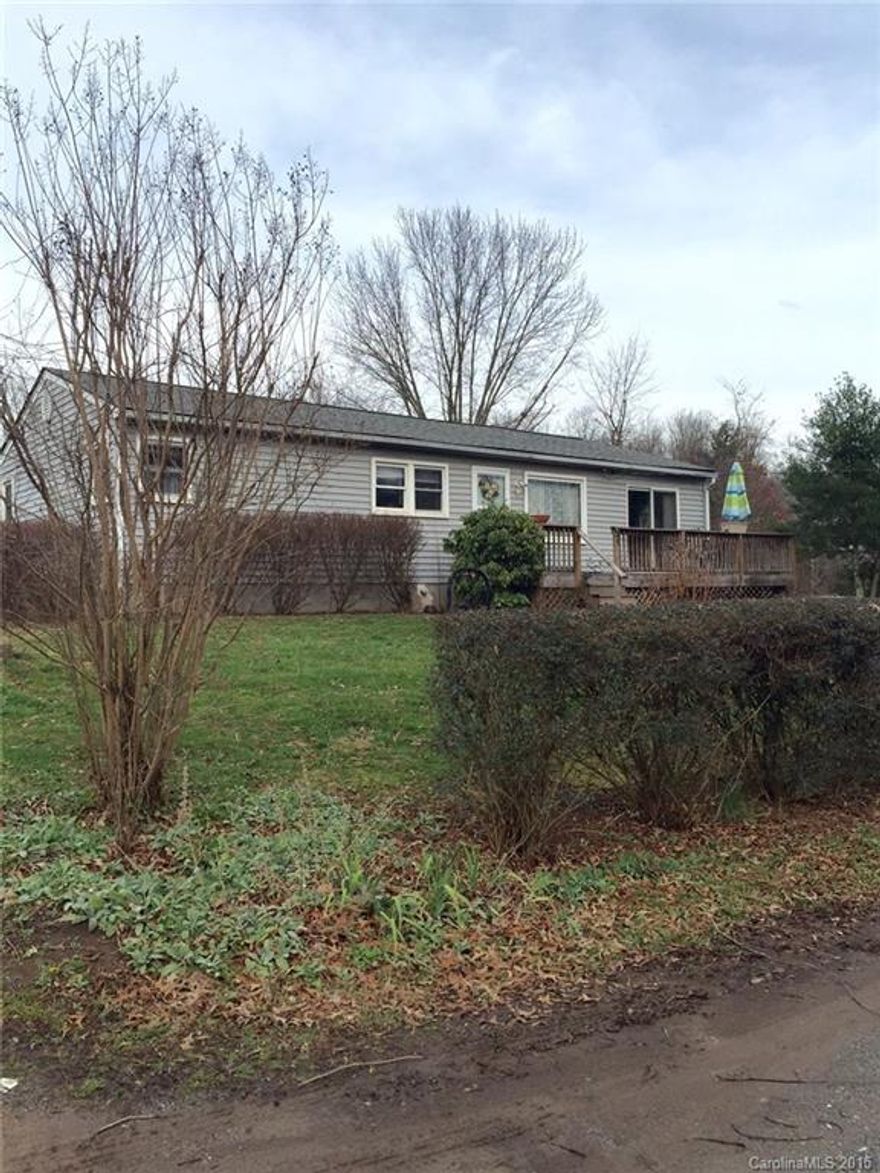 Great opportunity for first time home owner.Nice large lot for outdoor activities.Property at the end of the road for privacy.House has carpet throughout but original oak wood floors underneath.Great location 10 minutes from downtown Asheville.Three minutes to I-40 and I-26.Owner very motivated bring all offers.