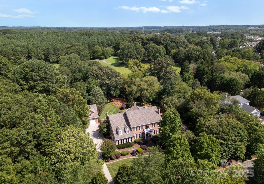 Welcome to your dream home nestled in the picturesque town of Davidson, known for its rich history and vibrant community. This exquisite property sits on over an acre of lush, private land. The outdoor space is a true oasis, featuring a stunning swimming pool surrounded by a spacious sundeck-perfect for sunbathing or hosting summer gatherings.The property boasts a 2 car attached garage as well as a  2 car detached with an apartment above.This versatile space features a Murphy bed and a full kitchen, complete with hardwood floors ideal for guests,an in-law suite,or a rental opportunity.Step inside the main house to discover a warm and inviting interior complete with beautiful hardwood floors and 4 fireplaces!Lower level is perfect for entertaining with a billiards area, wet bar and large screen TV. Located near entry to Greenway and just 1 mile from downtown , with its perfect blend of historic charm and modern conveniences, this home is truly a gem in Davidson.