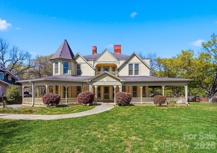 The Fox-Ingold House, known by most locals as the "Hospitality House," is now available! Located in the Claremont Historic District of downtown Hickory, this 1897 Queen Anne offers 5 bedrooms, 4 bathrooms and period detailing inside and out. Details include 9 fireplaces, each with unique mantels, hand carved stairway posts, stained glass windows, original hardwood flooring, original wainscoting, built-ins, the list goes on! The main level offers a large central foyer opening onto two front parlors, a dining room with original built-in china cabinet and wainscoting, main-level bedroom with en-suite bonus room, kitchen, laundry, and mud room. Wind your way upstairs via a hand-carved staircase made of heart pine, leading to another large landing with a stained glass exit to the centrally located upper level porch. Upstairs, four generously sized bedrooms all offer fireplaces and share a hall bathroom. Outside, a wonderful wrap-around porch welcomes guests year-round and features classic 19th century detailing that can only be found on historic properties. Located withing walking distance to downtown Hickory shopping and dining, LRU sporting events, and local schools and churches. Seller is a historic preservation organization requiring protective covenants attached to the deed at sale protecting the historic integrity of the structure, materials and site. Most changes proposed to the property will require seller’s review and approval. Modernization of the kitchen and baths are generally permitted. Roof on home will need to be replaced in near future. Seller is unsure of AC functionability.