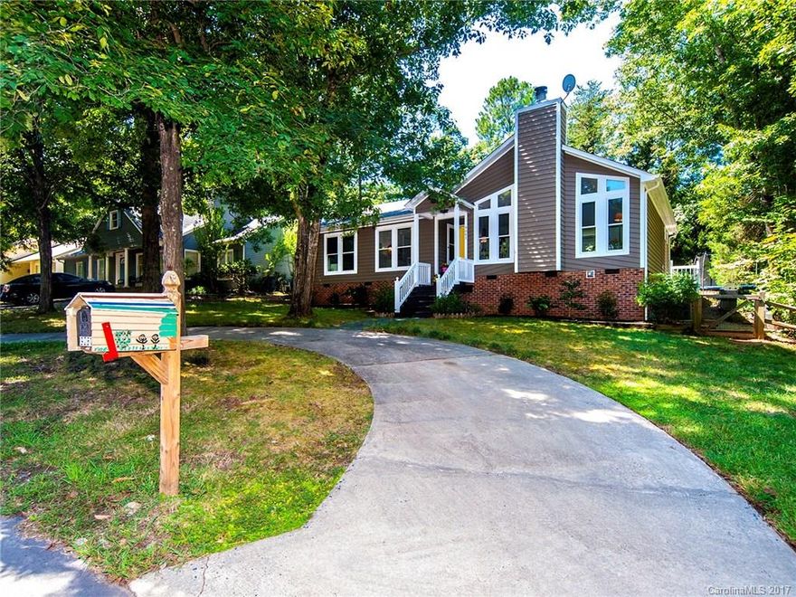 Extremely nice, bright open floor plan in this well-updated home and yard. Enjoy the gorgeous kitchen and dining areas that open to the vaulted family room w/ beautiful stone, wood-burning fireplace. Totally remodeled master bathroom with large shower & cabinet-style vanity. Hall bath has new tile floor, vanity & fixtures. Site-finished hardwood floors too!  Fenced in back yard with patio, fire pit area, kids play set, trampoline & large deck! 1 yr.Home Warranty provided!  A pleasure to show!