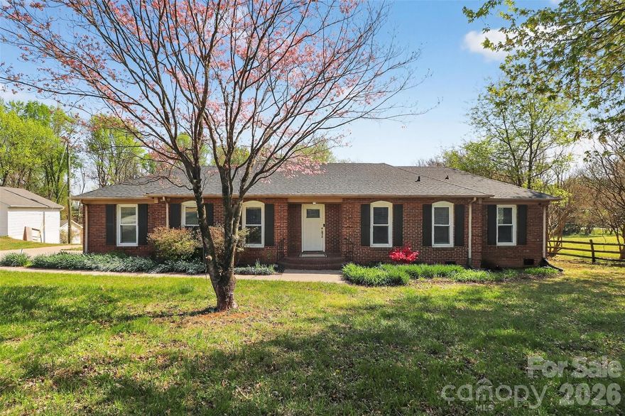 Completely reimagined and move-in ready, this beautifully updated 4-bedroom, 2-bath ranch offers the perfect blend of modern finishes and everyday functionality—all set on a spacious 0.79-acre lot. Step inside to find a fresh, cohesive interior featuring new luxury vinyl plank flooring, plush new carpet, and a fully renovated kitchen and bathrooms. The kitchen is designed to impress with granite countertops, updated cabinetry, built-in features, and a generous walk-in pantry for added storage and convenience. Both bathrooms have been thoughtfully remodeled with dual vanities, while the primary suite offers a true retreat with a custom multi-head walk-in shower and a spacious walk-in closet. Major systems have all been upgraded for peace of mind, including a new roof, HVAC system, water heaters, as well as updated plumbing and electrical. Enjoy outdoor living on the expansive deck overlooking the large lot—ideal for relaxing, entertaining, or simply enjoying the space around you. The property also includes a workshop/storage shed, city water service, and an additional private well. With extensive updates throughout and plenty of indoor and outdoor space, this home offers comfort, style, and versatility—ready for its next owner to enjoy.