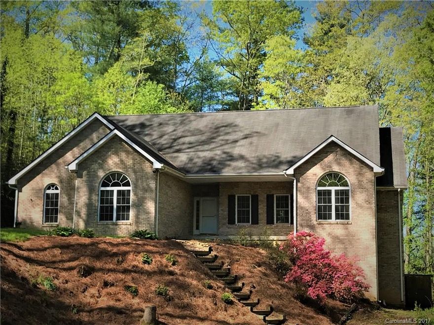 Mills River home you've been waiting for!  On private cul-de-sac in Mills Pointe, this brick home with 3 BRs on main and open floor plan is a dream!  Stainless appliances make the kitchen shine!  The master BR has a huge bath suite with TWO spacious walk-in closets!  The basement level boasts TWO bonus rooms + full bath and a great workshop space!  Covered porch, large deck, lovely wooded lot with perfect firepit space and so much more.  Pastoral neighborhood, yet minutes to AVL, Brevard, HVL!