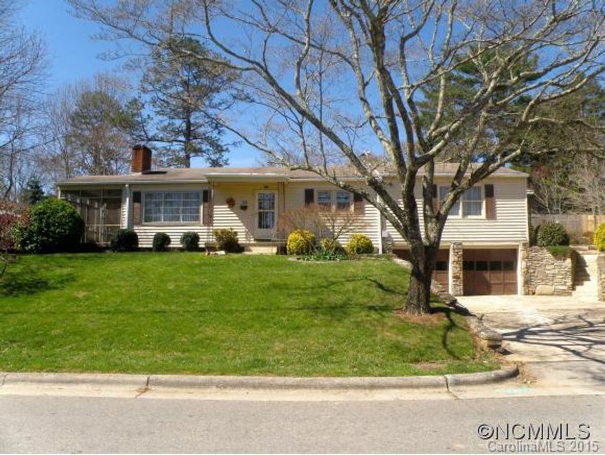 Spacious home on beautiful lot in handy West Asheville location w/fenced in backyard, 3 bedrooms, office, den & LR, side screen porch & rear covered porch, brick FP, AHS Home Warranty, 2-car gar in bsmt, newer gutters, all appliances stay, concrete drive