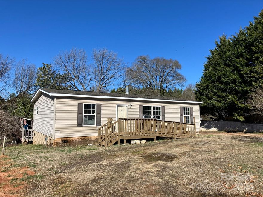Price Reduced! Good potential in this manufactured home on 2.69 acres! Rural setting with no restrictions so you can create your own mini homestead. Home needs repairs & updates - 1188 sf, fireplace in living room, split bedroom plan, 3 bedrooms, 2 baths. Outbuildings in need of repair. Selling As Is - owner will not remove personal property/debris in outbuildings or on property. Private well & septic. Septic tank was recently pumped. Public water available at the street. The listing includes 2 parcels: Pin# 1648056 & 1648055. Cash offers preferred, no owner financing or rent to own available. Conventional mortgage might be a possibility with good credit and down payment.