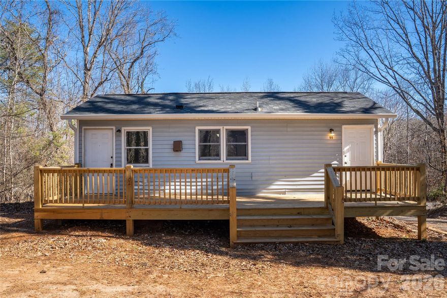 This beautifully updated 2-bedroom, 1-bath home sits on over half an acre, and the sale includes two parcels, offering added value and flexibility for a first-time homebuyer, downsizer, investor, or someone looking for a vacation home. Renovated in 2025, the home features a new roof, a fully remodeled kitchen with new appliances, a modern bathroom with a tiled shower, new LVP flooring, updated fixtures, new gutters, and a new deck. The heat pump is only two years old, ensuring efficient comfort year-round. Enjoy winter mountain views, public water and sewer, an outbuilding for extra storage, and a convenient location just minutes from downtown Tryon. With its fresh updates and scenic surroundings, this home offers a wonderful blend of comfort, quality, and convenience.