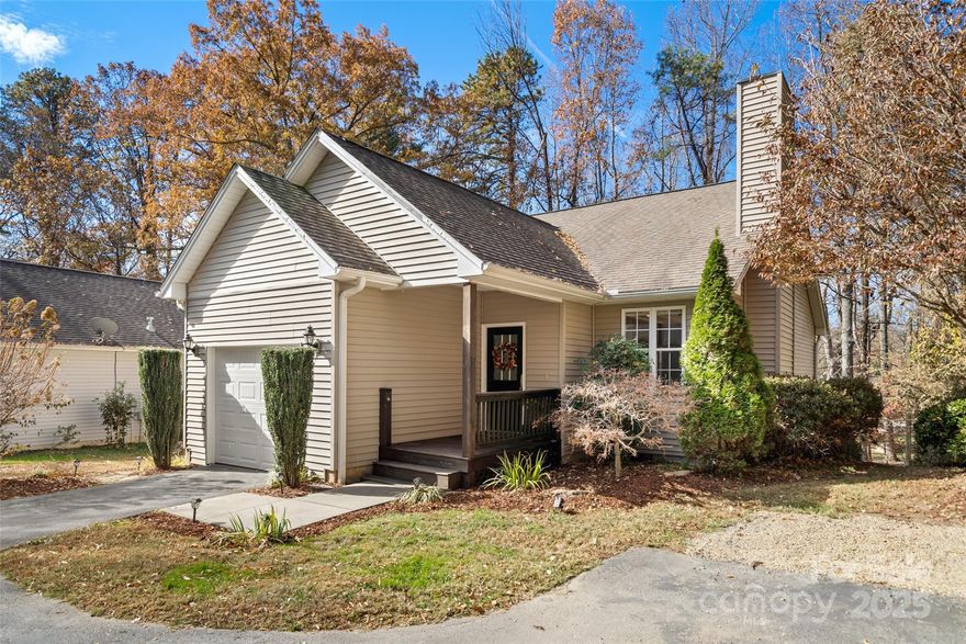 Welcome to 31 N Cottage Court in the Toms Hill area of downtown Hendersonville, NC.  This well designed 2 bedroom, 2 bath home features an open floor plan with cathedral ceilings and a huge island for entertaining.  The spacious bedrooms have private baths, walk-in closets, and build-in storage.  Recent upgrades include a lowered island with new kitchen counters, beautiful refinished hardwood oak floors, carpets, Navien tankless water heater, new cabinet and wall paint, and shiplap fireplace surround.  The one car garage has new door panels and epoxy flooring, it is currently used for a bonus entertainment space.  The deck is private and peaceful overlooking a park like setting and low maintenance yard with a lighted gravel path and fire pit area.  Conveniently located walking distance to Main Street, Dry Falls Brewery, Trailside Station, and the Ecusta Trail.  Short and long term rentals allowed.  Can be sold furnished if desired with an acceptable offer. Book your showing today!