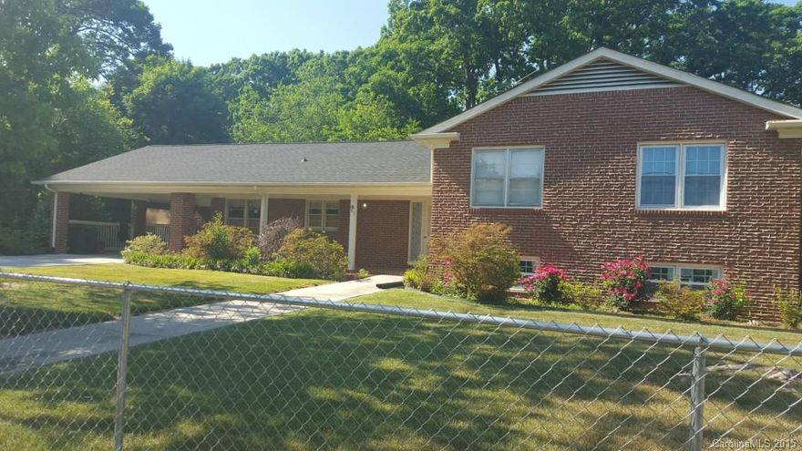 If you need space then this is the house for you. Beautiful home on two lots, fenced yard, patio w/ privacy fence, hot tub, walk out lower level w/lots of natural light, rec room with pool table that conveys, fireplace, full bath and additional bedroom or den. Lower level also has workshop area w/ access to backyard.  Don't let the age of this home fool you.  New roof installed in 2014, windows, paint, newly refinished hardwood floors. Electrical updated several years ago. Home is move-in ready.