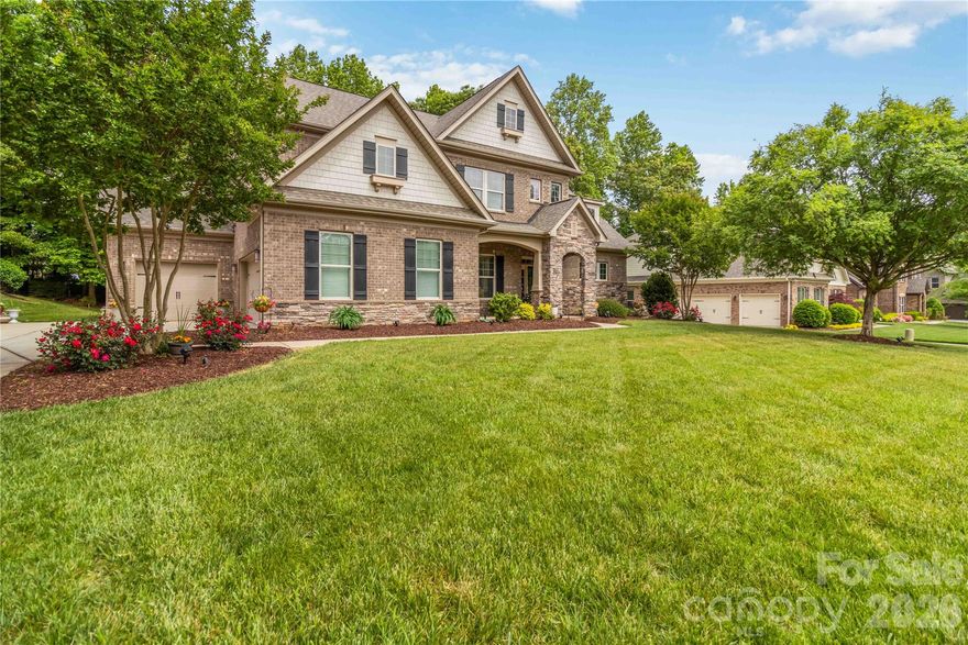 Exceptional full-brick luxury home in the sought-after Barber Rock community! This meticulously maintained residence showcases a main-level primary suite, a grand two-story great room with a striking stone fireplace, and a spacious three-car garage—perfectly blending comfort and refined design.

Enjoy serene outdoor living from the covered front porch or unwind in the private, tree-lined backyard offering added privacy. Thoughtfully appointed upgrades include central vacuum, professional landscape lighting, and full irrigation in both front and rear yards.

Barber Rock offers desirable community amenities, including a clubhouse, outdoor pool, playground, and recreation areas. Ideally located near Fort Mill, Indian Land, and Ballantyne, with convenient access to shopping, dining, and major commuter routes. An exceptional opportunity to own a luxury home in a prime location. Schedule your private tour today!
