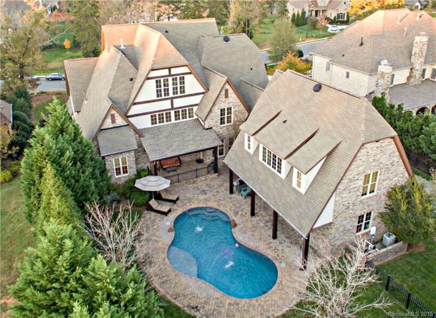 Stunning French Country estate in Gated Providence Downs South! Fantastic open floor plan featuring private GUEST HOUSE, salt water pool, climate controlled wine cellar & large 1st floor Master Retreat. Giant Chef's Kitchen w/commercial grade appliances & huge 9 ft island! Kitchen opens to gorgeous great room w/stone archway, custom cedar beamed ceiling, stone fireplace & built in cabinets! Bonus, Media & Exercise rooms.  Quality built! Priced to sell! One of a kind property! A true must see!